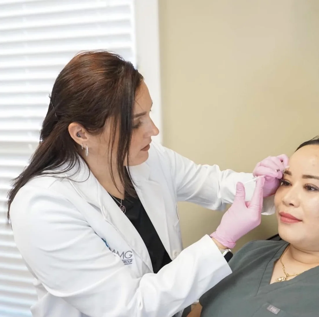 A Magnolia Medical Group provider performing an aesthetic treatment